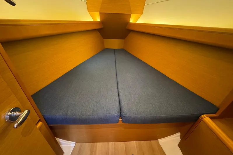 Sea Ranch II Yacht Photos Pics Interior cabin of 2018 Jeanneau Sun Odyssey 389 sailboat with blue cushions.