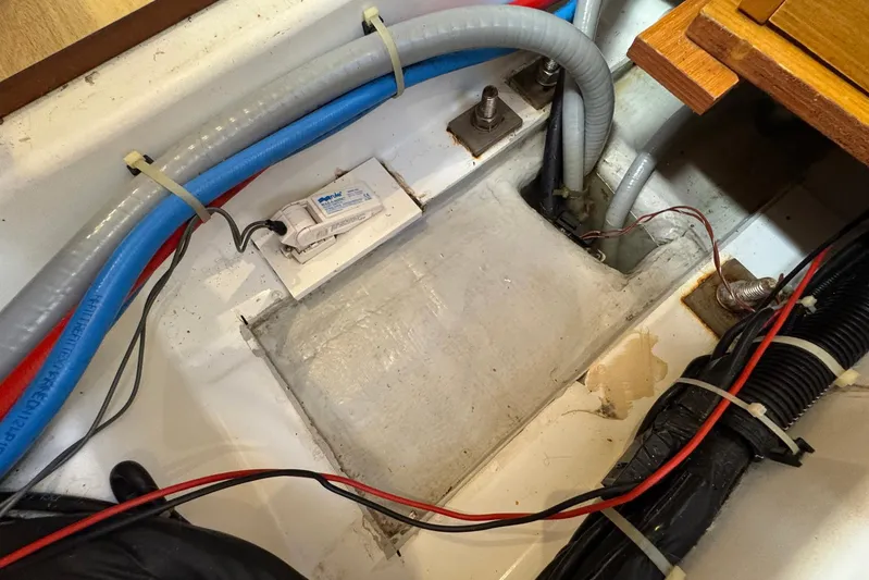 Sea Ranch II Yacht Photos Pics Bilge area of 2018 Jeanneau Sun Odyssey 389 sailboat with wiring and hoses.