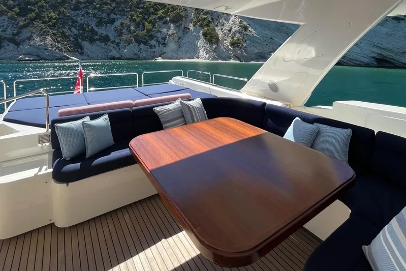 Inspiration B Yacht Photos Pics Luxurious 2006 Ferretti Custom Line 97 yacht deck with elegant seating and scenic ocean view.