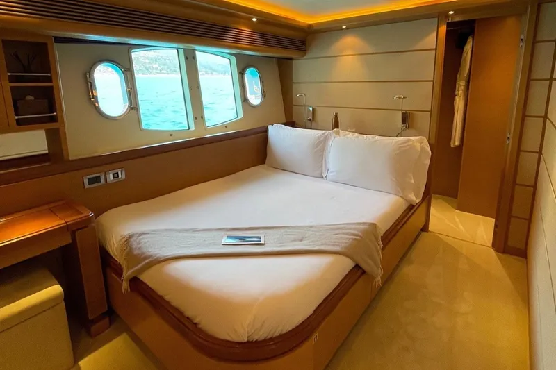 Inspiration B Yacht Photos Pics Luxurious bedroom interior of 2006 Ferretti Custom Line 97 yacht with ocean view.