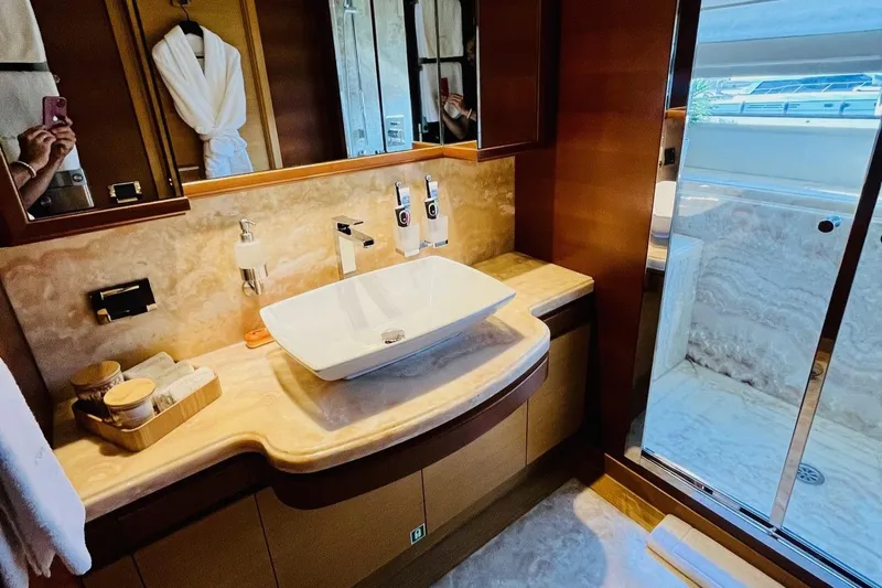 Inspiration B Yacht Photos Pics Luxurious bathroom on a 2006 Ferretti Custom Line 97 yacht with elegant marble finishes.