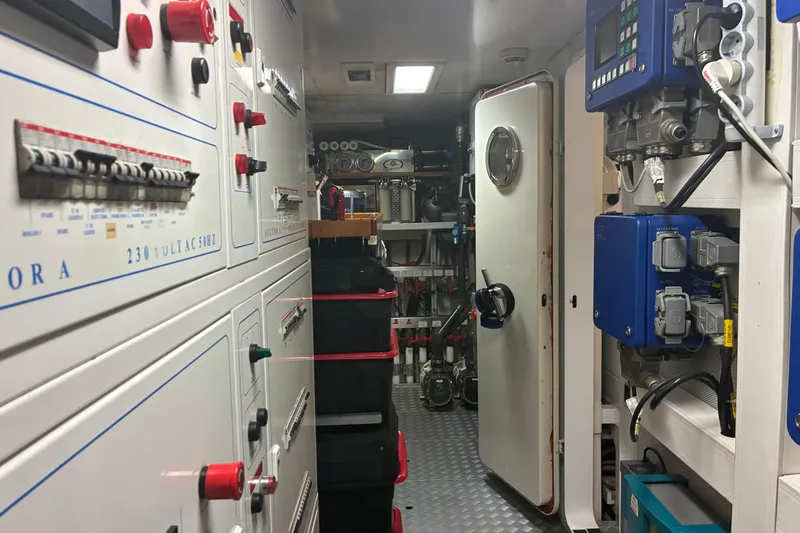 Inspiration B Yacht Photos Pics Engine room of 2006 Ferretti CUSTOM LINE yacht with control panels and equipment.