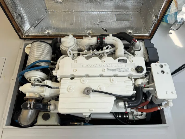 Wrecking Crew Yacht Photos Pics Engine compartment of a 2006 Fortier 26 boat, featuring a Cummins marine engine.