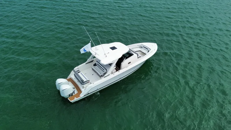  Yacht Photos Pics 2021 Tiara Sport 34 LS boat on open water, aerial view.