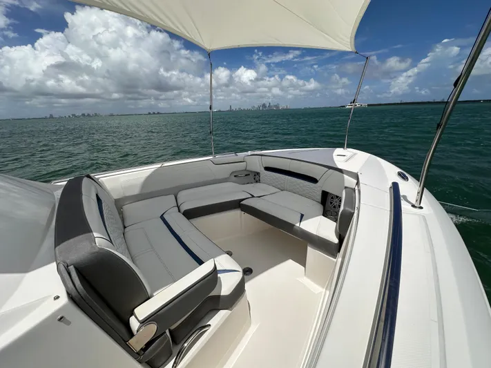  Yacht Photos Pics 2021 Tiara Sport 34 LS boat with spacious seating on open water.