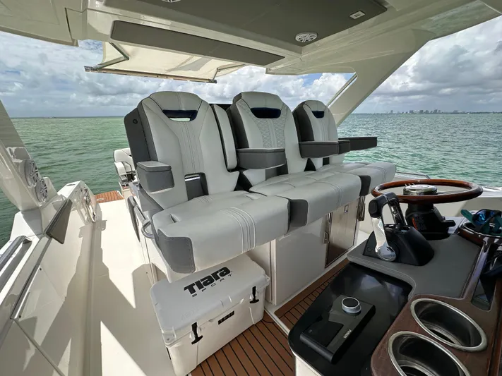  Yacht Photos Pics 2021 Tiara Sport 34 LS boat interior with luxury seating and helm, ocean view.