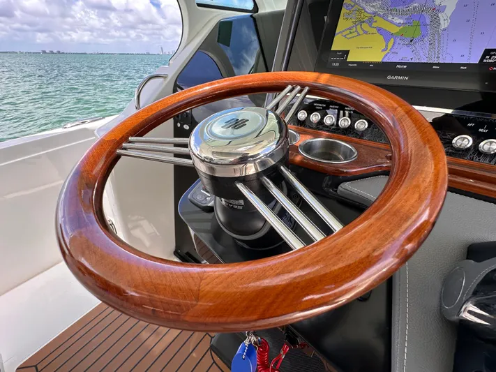  Yacht Photos Pics 2021 Tiara Sport 34 LS boat steering wheel with navigation display.
