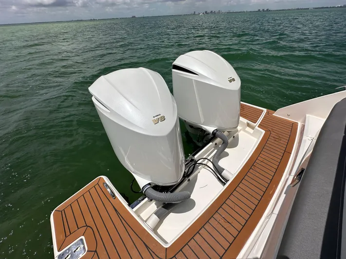  Yacht Photos Pics 2021 Tiara Sport 34 LS boat with twin outboard engines on water.