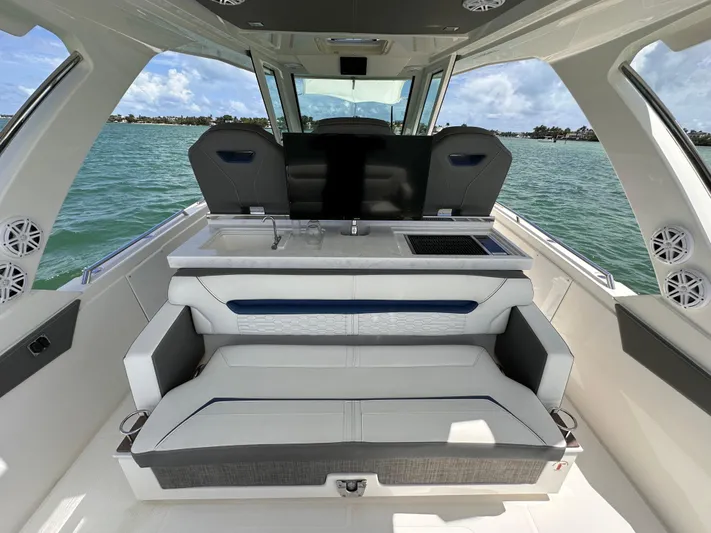  Yacht Photos Pics 2021 Tiara Sport 34 LS boat interior with seating, ocean view, and modern design.