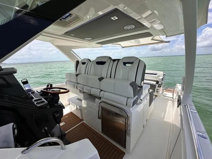  Yacht Photos Pics 2021 Tiara Sport 34 LS boat interior with luxurious seating and ocean view.
