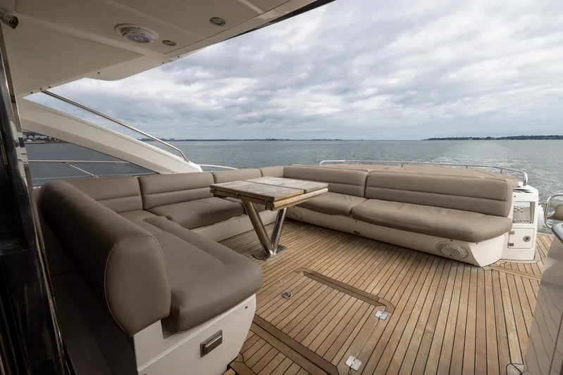 Yolo Yacht Photos Pics Spacious deck seating on 2014 Sunseeker Predator yacht with ocean view.