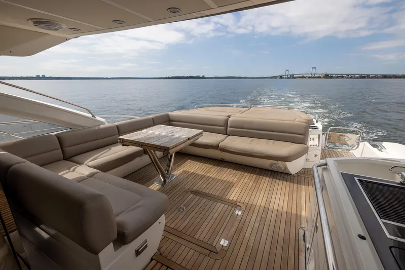 Yolo Yacht Photos Pics 2014 Sunseeker Predator yacht deck with luxurious seating and ocean view.