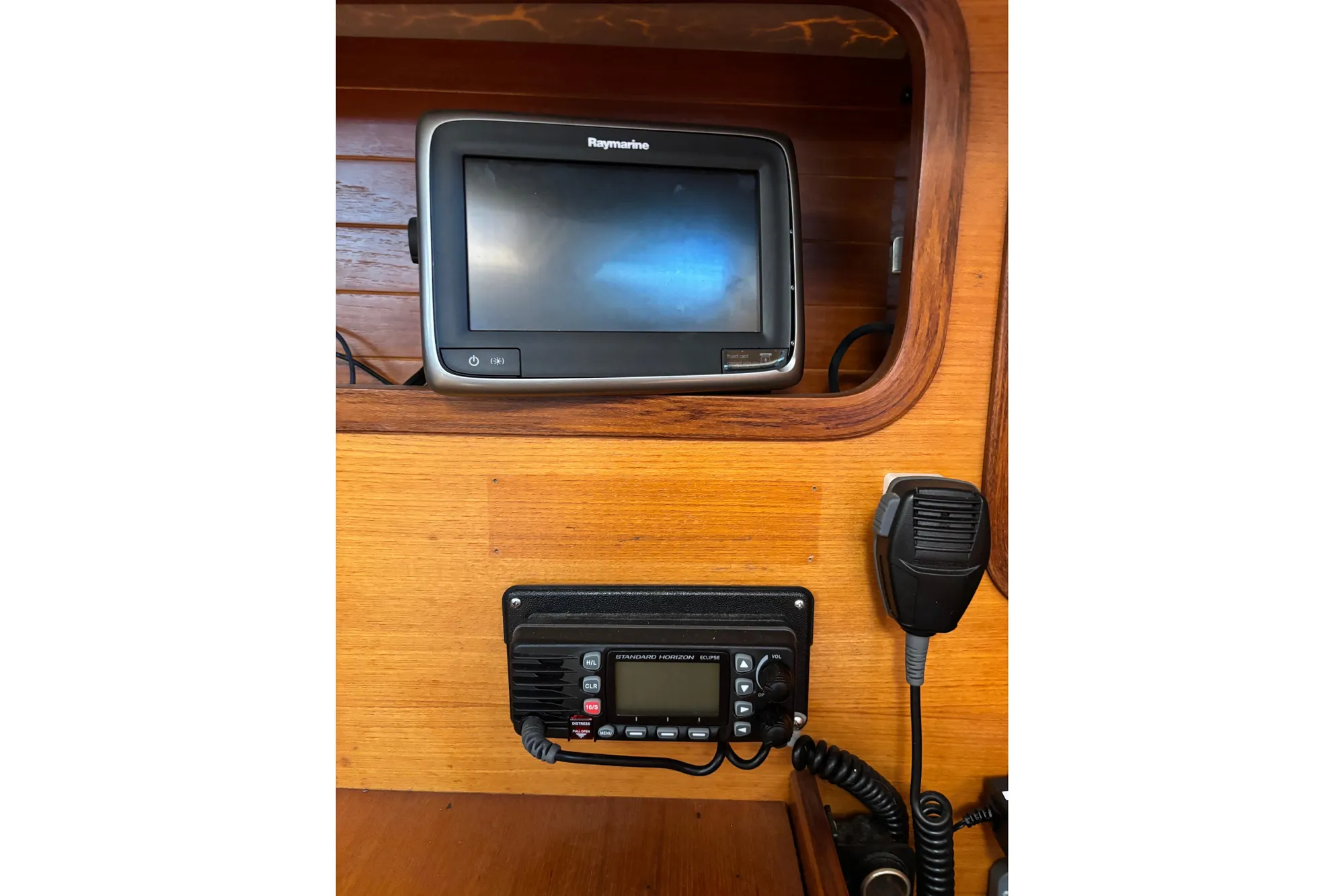 Navigation equipment on 1986 Beneteau First 375 sailboat, featuring Raymarine display and radio.