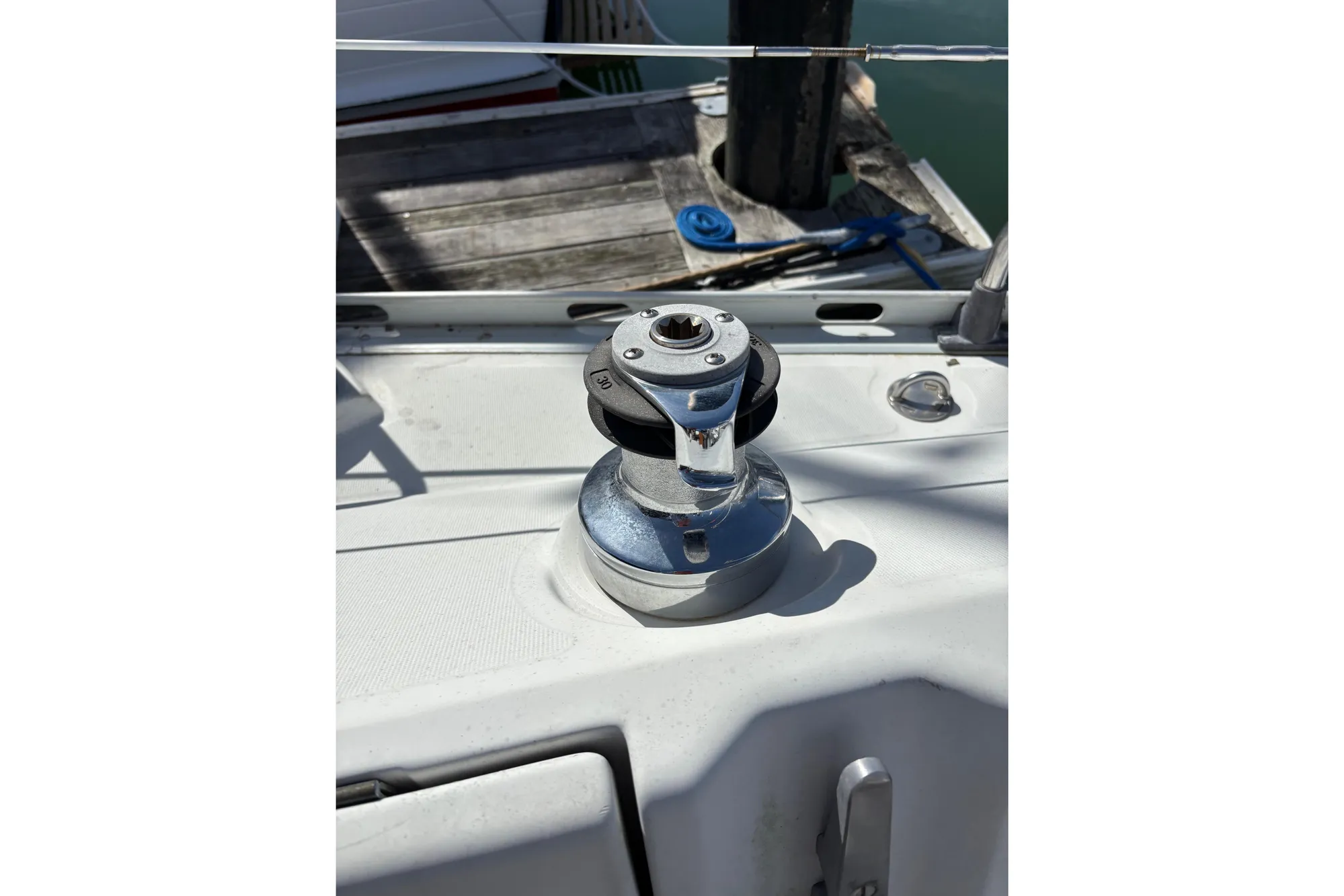 Winch on 1986 Beneteau First 375 sailboat deck, dockside view.
