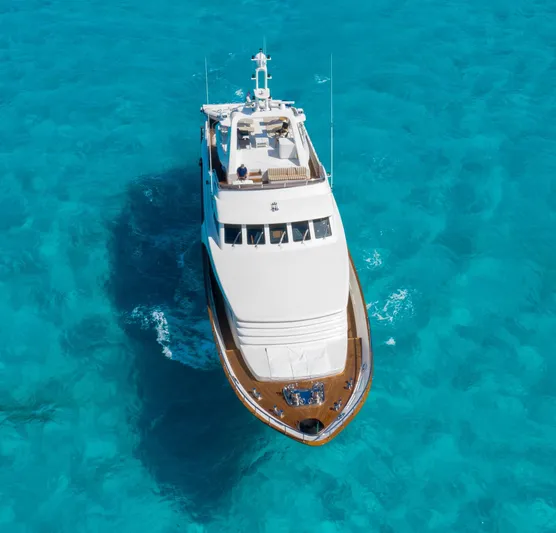 Sunrise Yacht Photos Pics Luxury yacht Ses Yachts SES 34, 2007 model, cruising in clear turquoise waters.