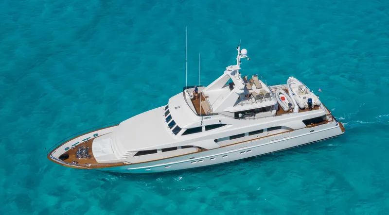 Sunrise Yacht Photos Pics Luxury 2007 Ses Yachts SES 34 cruising on clear turquoise waters.