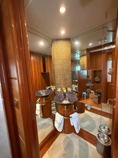 Sunrise Yacht Photos Pics Luxurious bathroom interior of 2007 Ses Yachts SES 34 with elegant fixtures and wood accents.