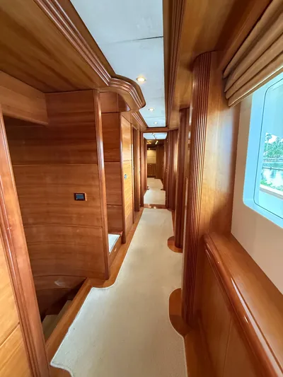 Sunrise Yacht Photos Pics Luxurious wooden interior hallway of 2007 Ses Yachts SES 34.