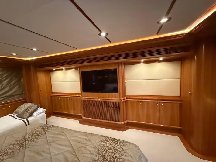 Sunrise Yacht Photos Pics Luxurious interior of 2007 Ses Yachts SES 34 with elegant wood paneling and modern lighting.