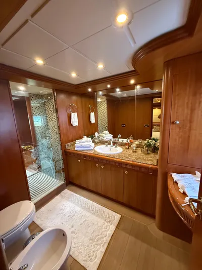 Sunrise Yacht Photos Pics Luxurious bathroom interior of 2007 Ses Yachts SES 34 with elegant wood finishes.