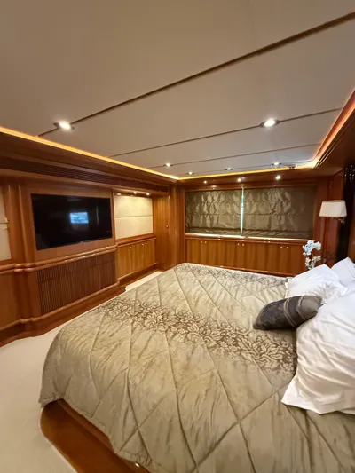 Sunrise Yacht Photos Pics Luxurious bedroom interior of 2007 Ses Yachts SES 34 with elegant wood paneling.