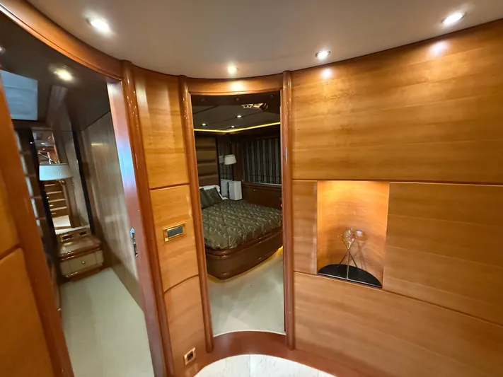 Sunrise Yacht Photos Pics Luxurious interior of 2007 Ses Yachts SES 34, featuring elegant wood paneling and ambient lighting.