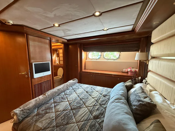 Sunrise Yacht Photos Pics Luxurious cabin interior of 2007 Ses Yachts SES 34 with elegant wood finishes.