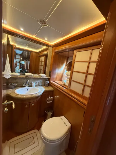 Sunrise Yacht Photos Pics Luxurious bathroom in 2007 Ses Yachts SES 34, featuring elegant wood finishes and modern amenities.