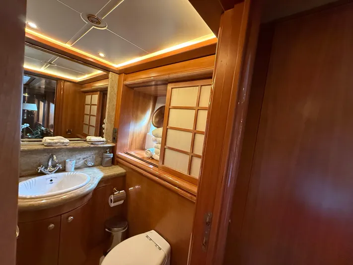 Sunrise Yacht Photos Pics Luxurious bathroom interior of 2007 Ses Yachts SES 34 with wooden accents and modern fixtures.