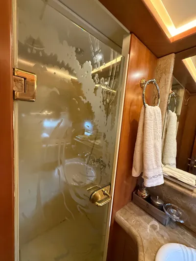 Sunrise Yacht Photos Pics Luxurious bathroom in 2007 Ses Yachts SES 34, featuring frosted glass shower and elegant fixtures.