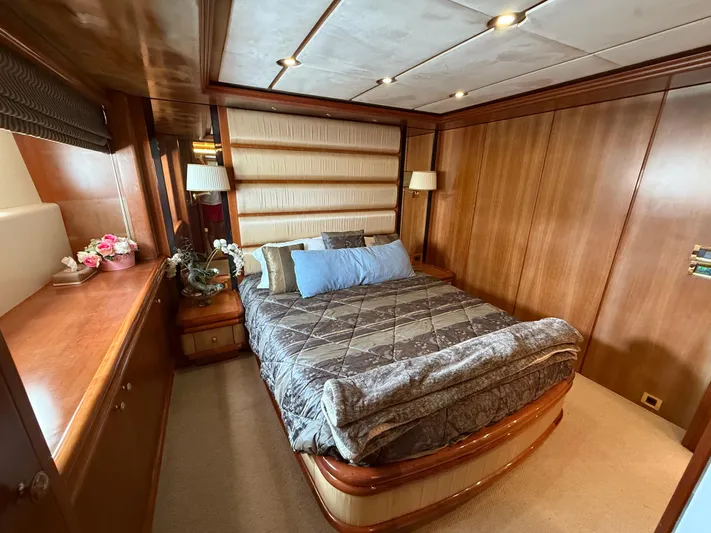 Sunrise Yacht Photos Pics Luxurious cabin interior of 2007 Ses Yachts SES 34 with elegant wood paneling.