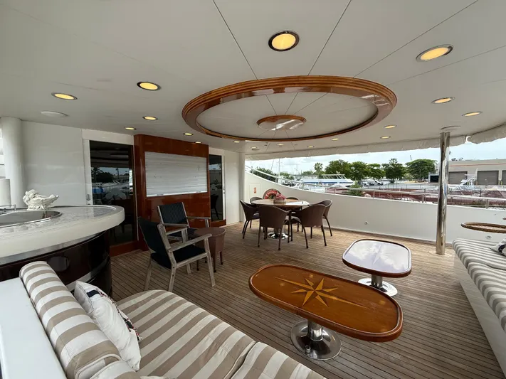 Sunrise Yacht Photos Pics Luxurious 2007 Ses Yachts SES 34 deck with elegant seating and dining area.