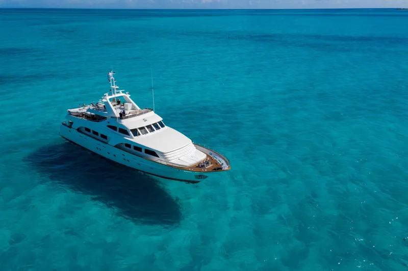 Sunrise Yacht Photos Pics Luxury yacht Ses Yachts SES 34, 2007 model, cruising in clear turquoise waters.