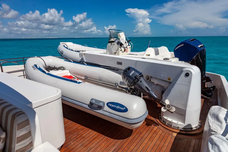 Sunrise Yacht Photos Pics 2007 Ses Yachts SES 34 with inflatable boats on deck, set against a clear blue sea.