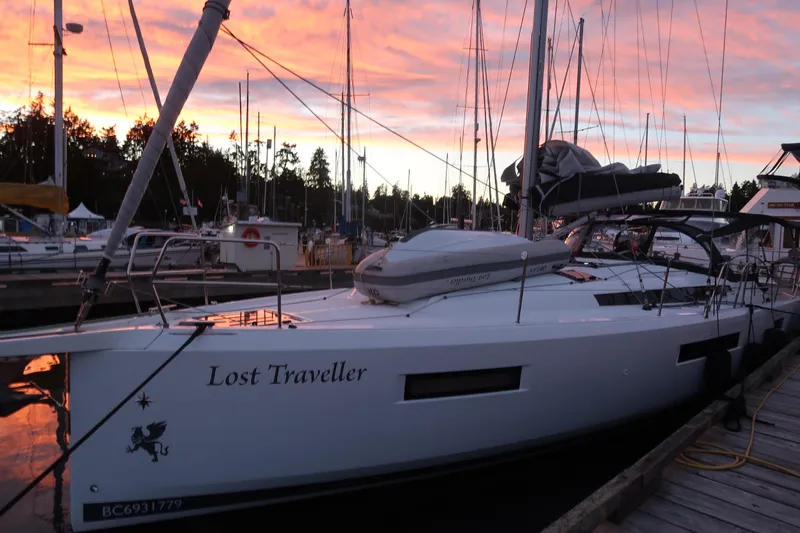 Lost Traveler Yacht Photos Pics Jeanneau Sun Odyssey 440 sailboat docked at sunset, 2020 model, named "Lost Traveller".