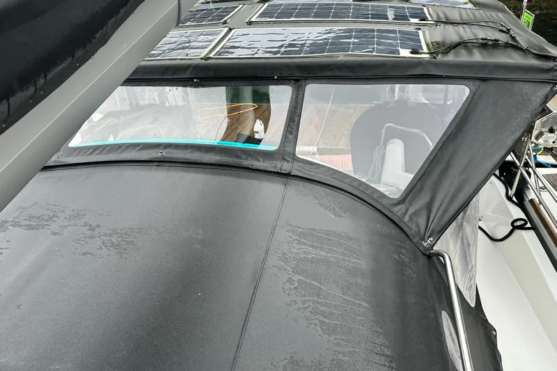 Lost Traveler Yacht Photos Pics 2020 Jeanneau Sun Odyssey 440 with solar panels and protective canopy.