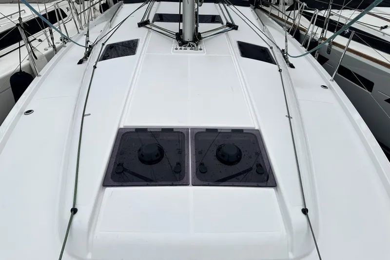 Lost Traveler Yacht Photos Pics Deck view of 2020 Jeanneau Sun Odyssey 440 sailboat, featuring sleek design and hatches.