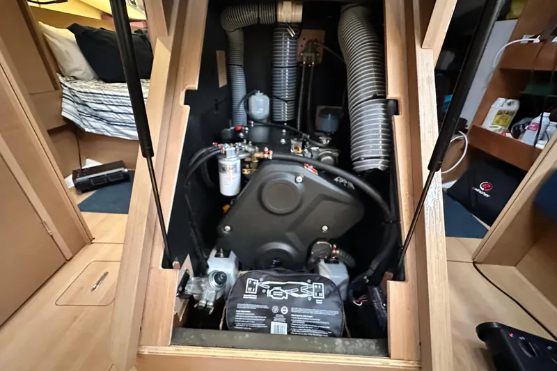 Lost Traveler Yacht Photos Pics Engine compartment of 2020 Jeanneau Sun Odyssey 440 sailboat, showcasing mechanical components.
