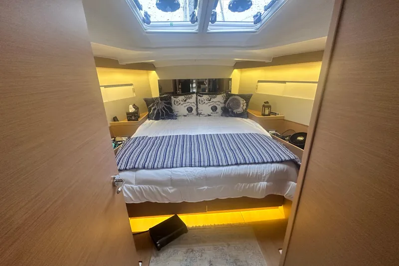Lost Traveler Yacht Photos Pics Luxurious cabin interior of 2020 Jeanneau Sun Odyssey 440 yacht with cozy bedding.