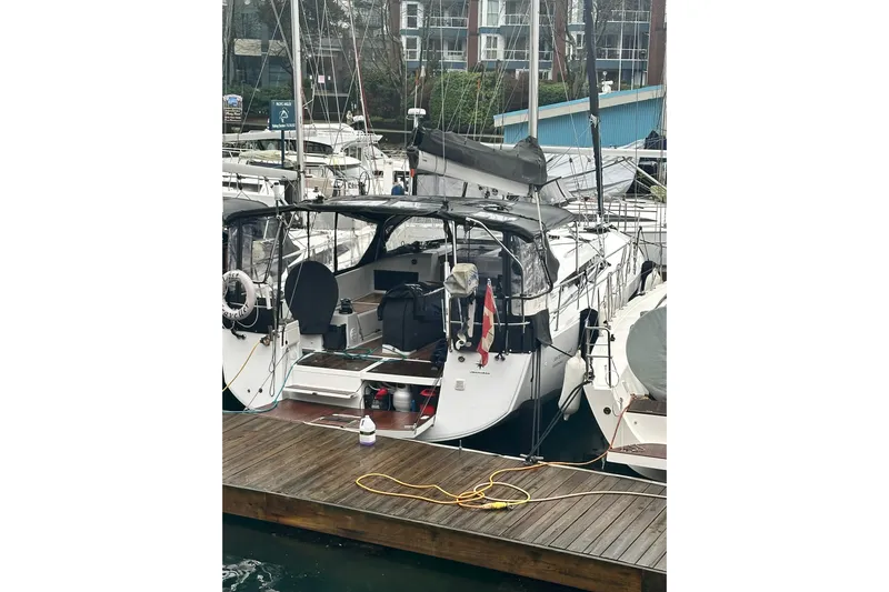Lost Traveler Yacht Photos Pics 2020 Jeanneau Sun Odyssey 440 yacht docked at marina, rear view.