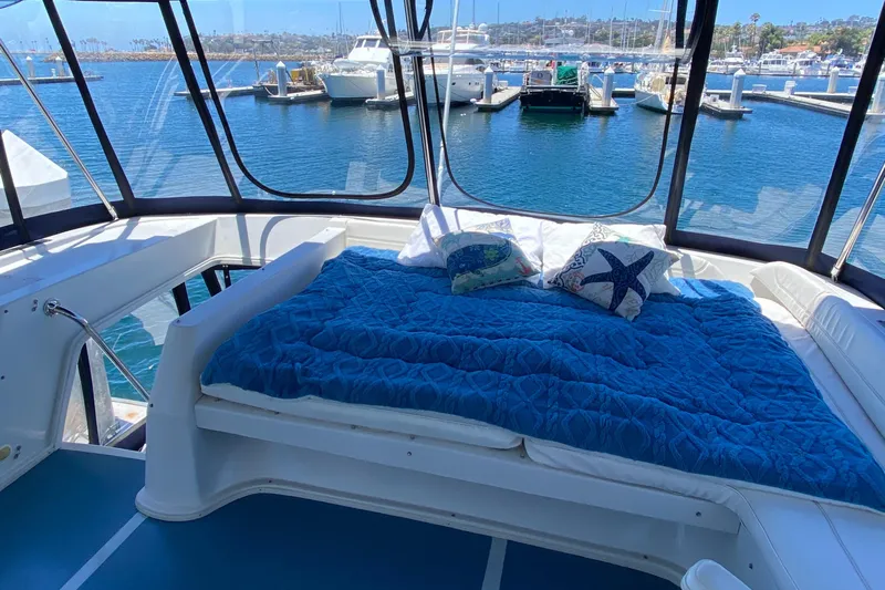 Dianne Yacht Photos Pics Luxurious 2003 Bluewater Yachts 6000 custom series with cozy deck bed and marina view.