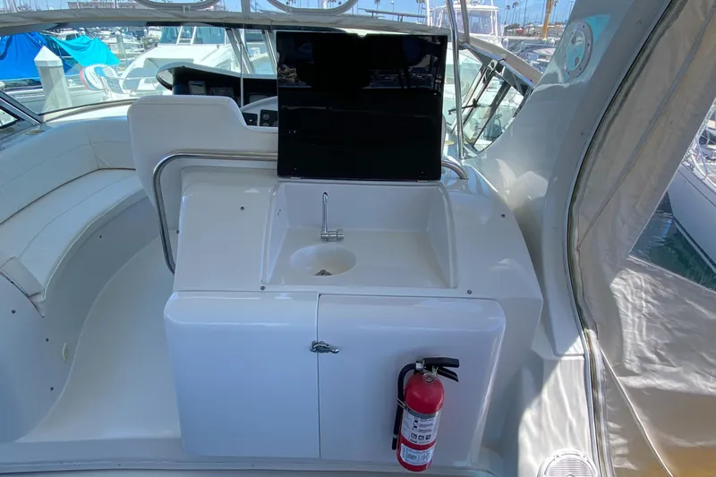 Dianne Yacht Photos Pics 2003 Bluewater Yachts 6000 custom series interior with sink and fire extinguisher.