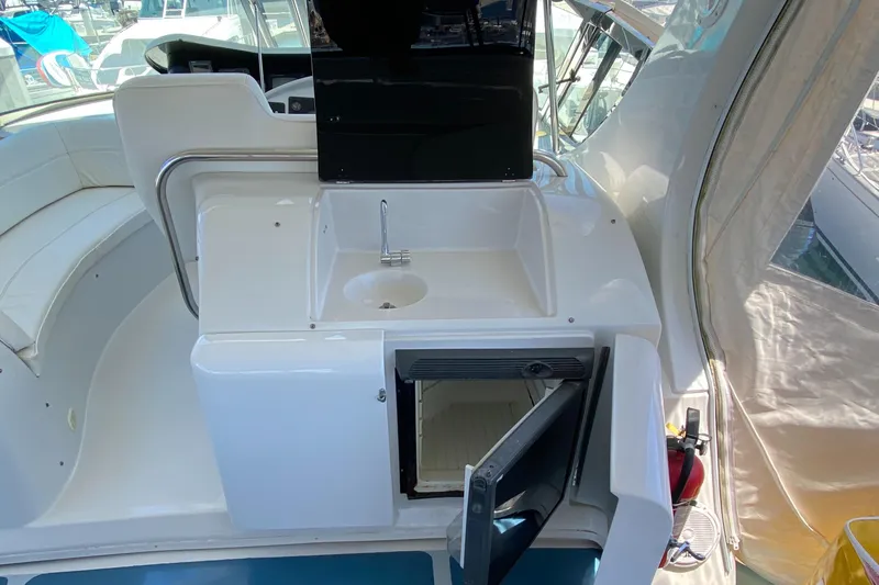 Dianne Yacht Photos Pics 2003 Bluewater Yachts 6000 custom series interior with sink and open storage compartment.