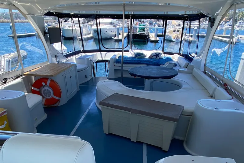 Dianne Yacht Photos Pics Luxurious 2003 Bluewater Yachts 6000 custom series interior with seating and marina view.