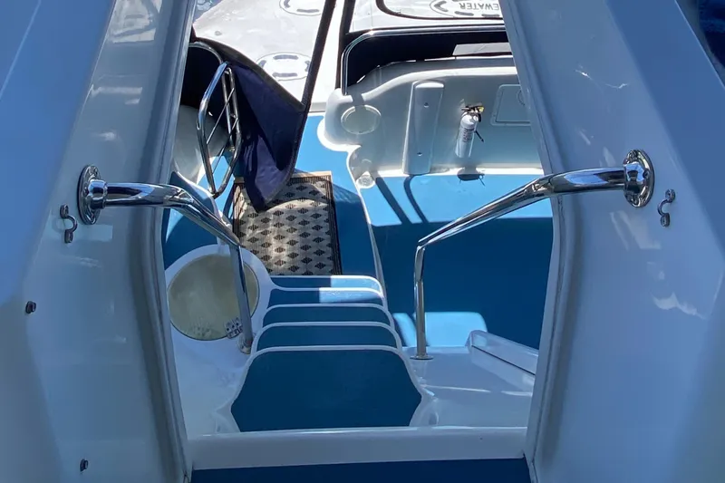 Dianne Yacht Photos Pics Staircase on 2003 Bluewater Yachts 6000 custom series, featuring sleek chrome railings.