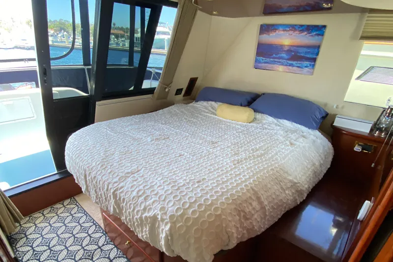 Dianne Yacht Photos Pics Luxurious bedroom in 2003 Bluewater Yachts 6000 custom series with waterfront view.