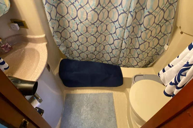 Dianne Yacht Photos Pics Bathroom interior of 2003 Bluewater Yachts 6000 custom series with shower and sink.