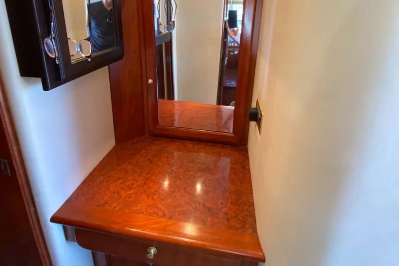 Dianne Yacht Photos Pics Luxurious wooden vanity area on 2003 Bluewater Yachts 6000 custom series.