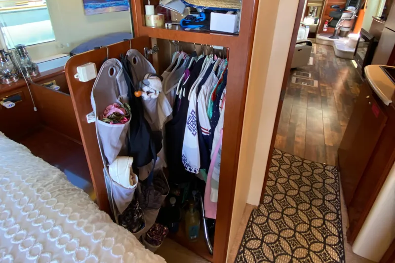 Dianne Yacht Photos Pics Interior of 2003 Bluewater Yachts 6000, featuring a compact closet and hallway view.