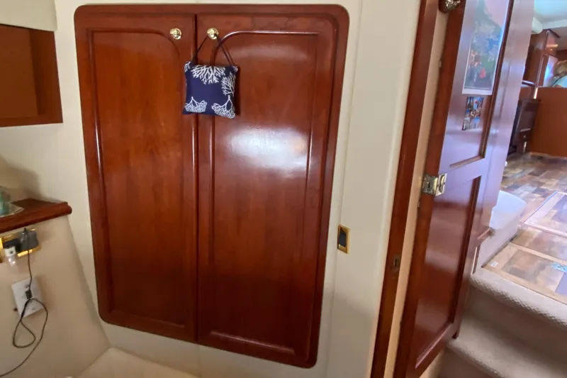 Dianne Yacht Photos Pics Interior of 2003 Bluewater Yachts 6000, featuring wooden cabinetry and nautical decor.